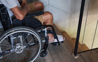 Male wheelchair user having problems with climbing down stairs
